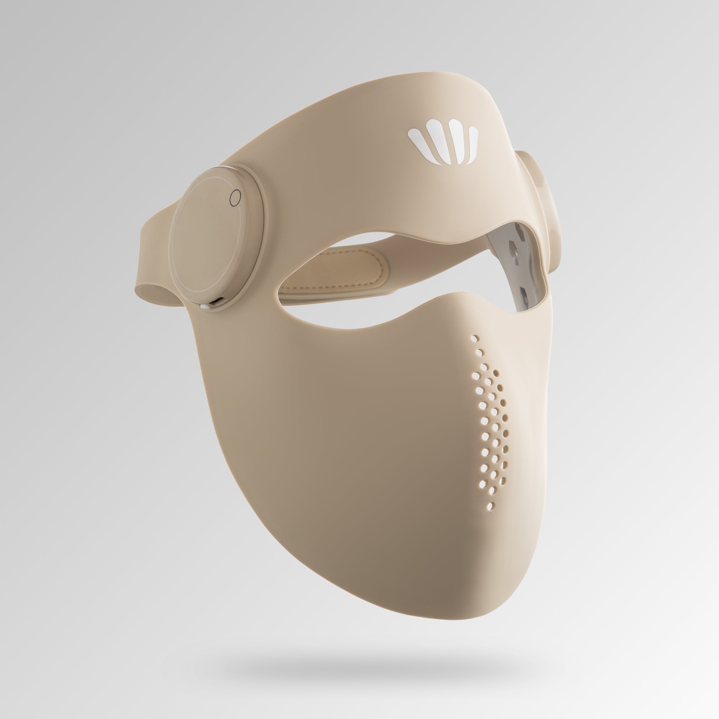 Beige silcione red light therapy face mask with a white brand logo