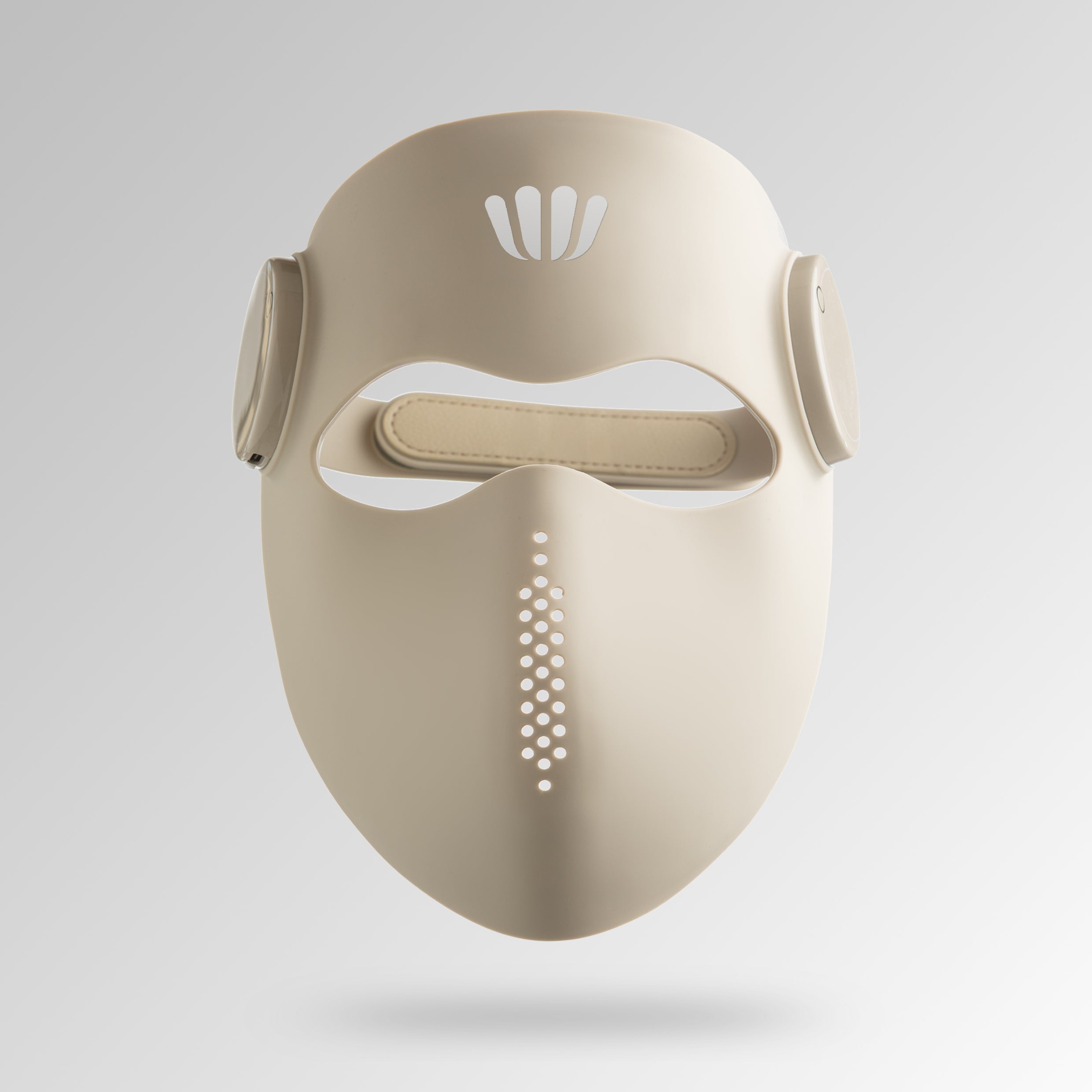 Beige red light therapy face mask with white design on a light gray background